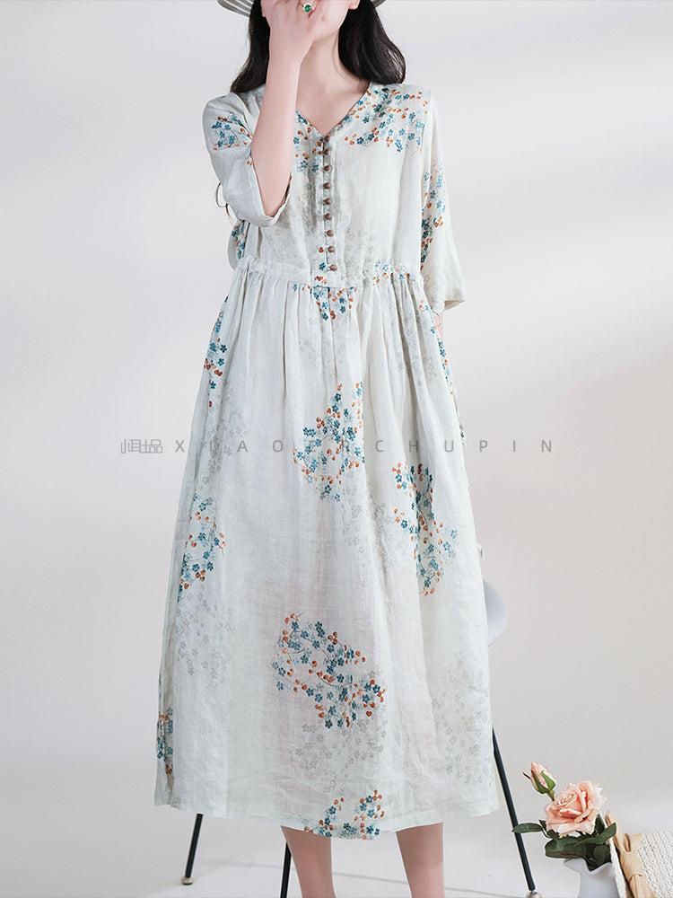 DÜĞMELİ BAĞCIKLI YAZLIK ÇİÇEKLİ ELBİSE