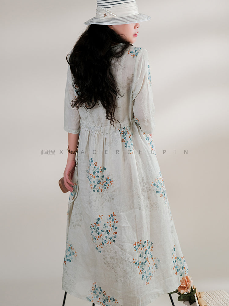 DÜĞMELİ BAĞCIKLI YAZLIK ÇİÇEKLİ ELBİSE